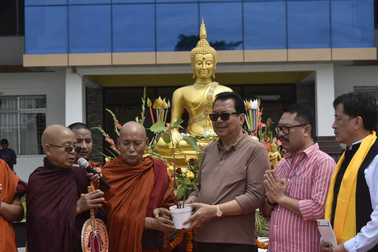 A gathering beside the Buddha statue