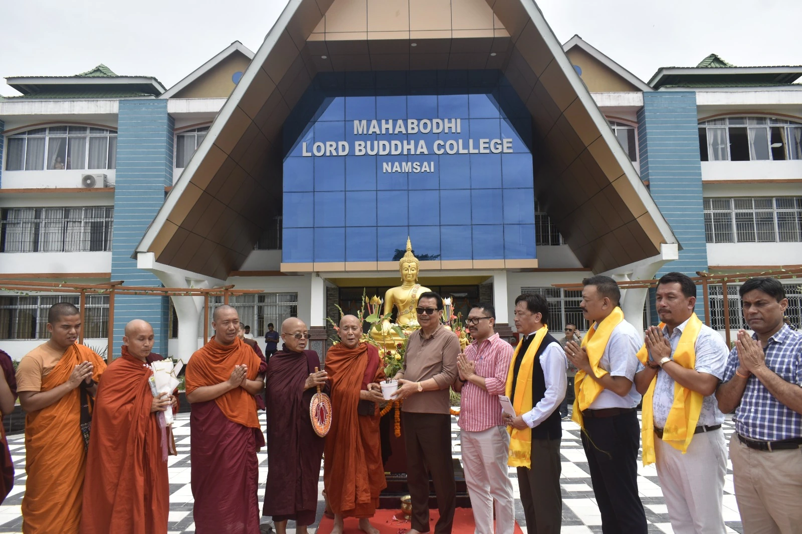 A gathering outside the college building
