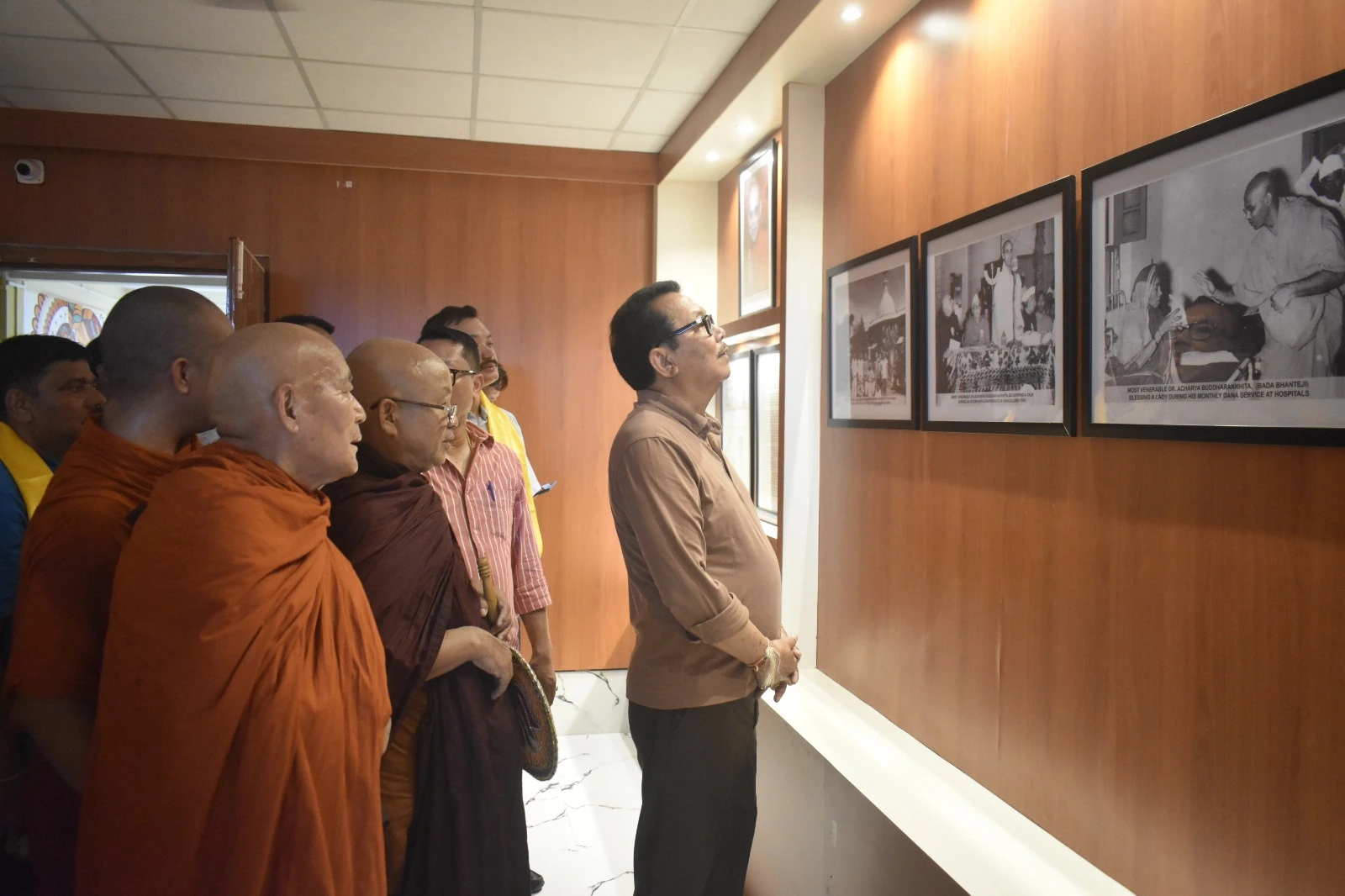 Guests viewing the college photograph display