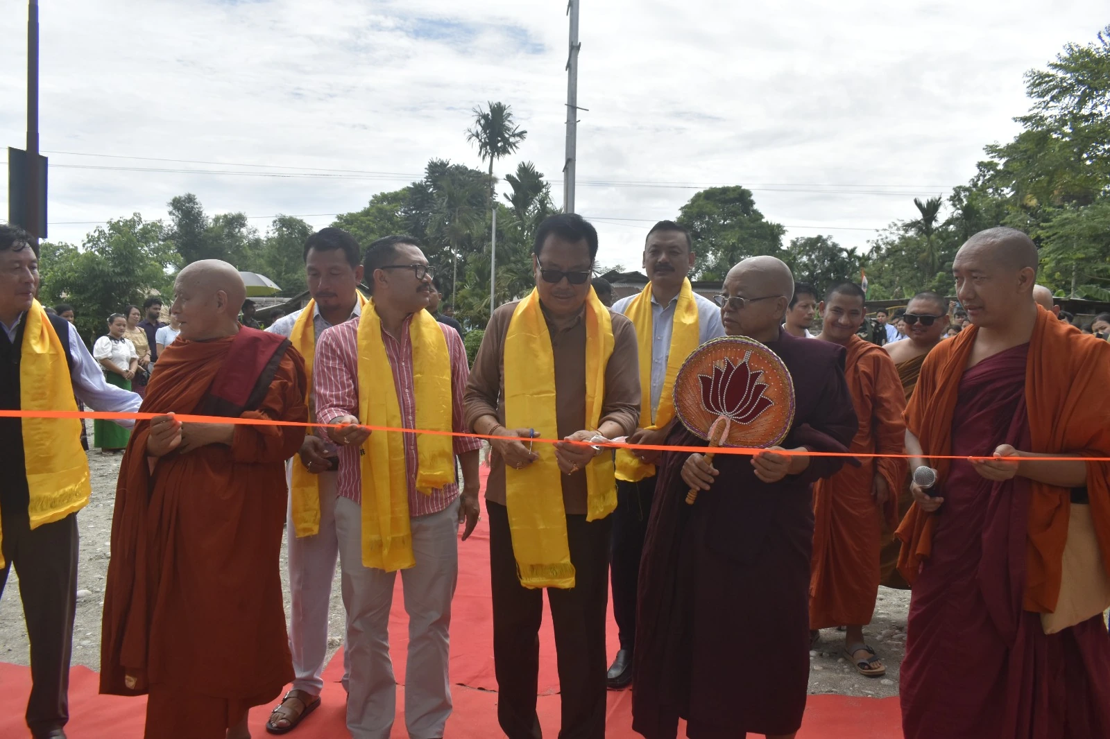 A ribbon-cutting gathering in the campus grounds