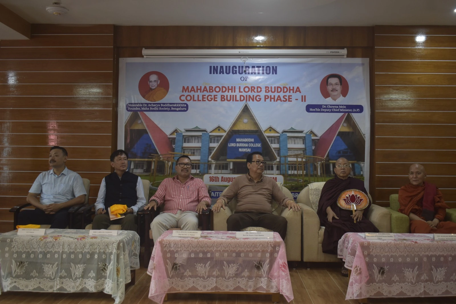 Guests on stage at a college programme
